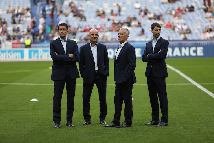 Le 9 septembre 2018 avant France-Pays-Bas, le staff au complet (et en costume). De gauche à droite, Franck Raviot, Guy Stéphan, Didier Deschamps et Grégory Dupont.
